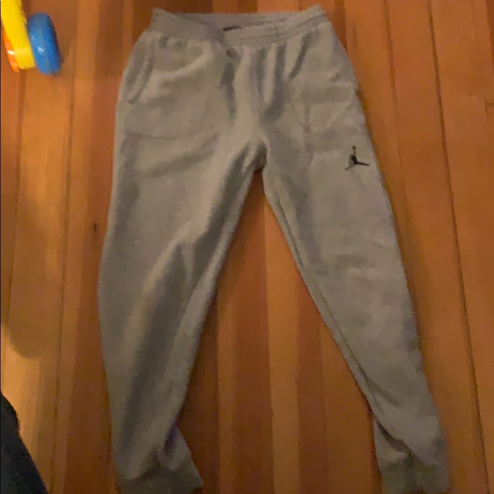 A pair of grey Jordan sweatpants